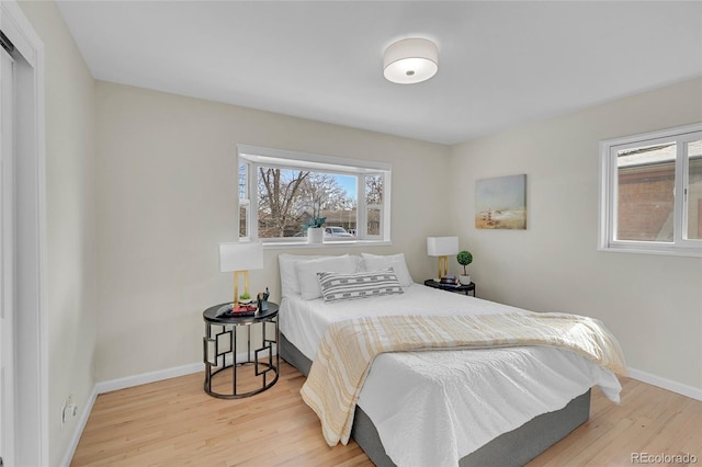 bedroom with hardwood / wood-style floors