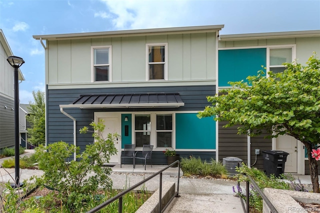 2829 W 53rd Ave Unit 104, Denver, CO 80221 - view of front of house with a standing seam roof, a metal roof, and covered porch