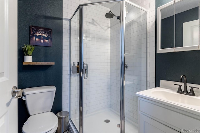 2829 W 53rd Ave Unit 104, Denver, CO 80221 - bathroom with vanity, a stall shower, and a textured wall