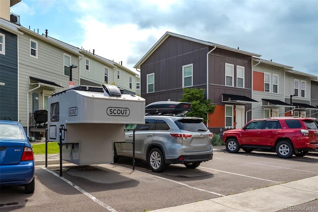 2829 W 53rd Ave Unit 104, Denver, CO 80221 - uncovered parking lot with a residential view