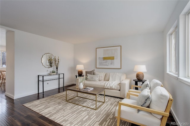 living room with wood finished floors and baseboards