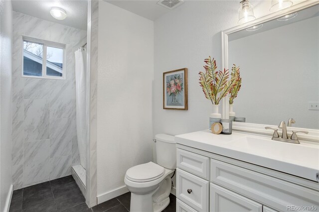 bathroom with vanity, visible vents, tile patterned flooring, curtained shower, and toilet