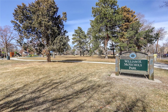 view of property's community with a lawn