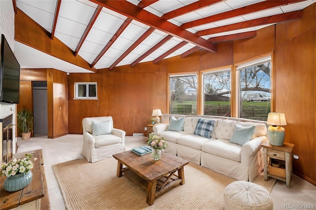 living area with lofted ceiling with beams and wood walls