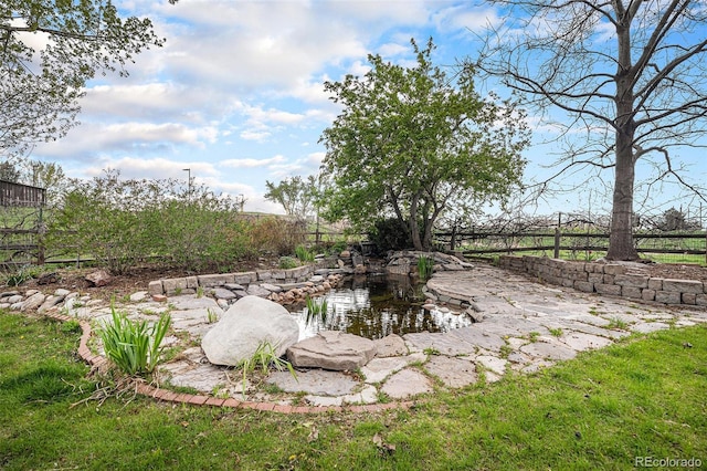 view of yard featuring fence