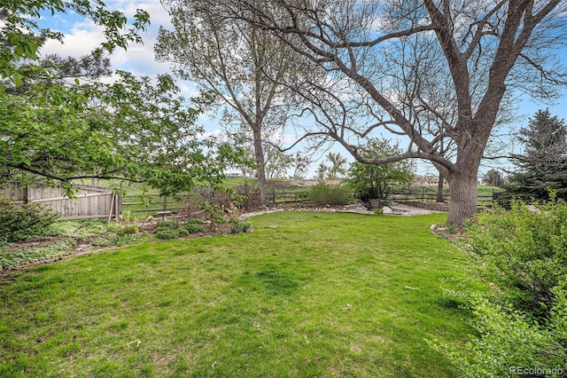 view of yard featuring fence