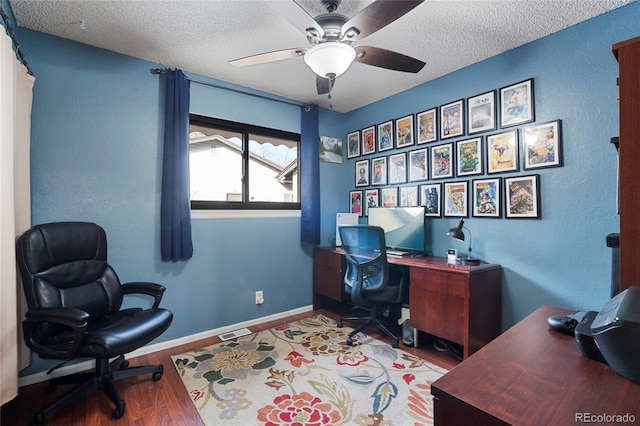 office space featuring ceiling fan, hardwood / wood-style floors, and a textured ceiling