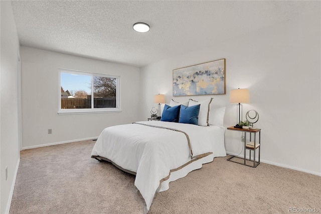 carpeted bedroom featuring a textured ceiling