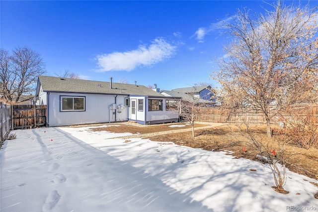 view of snow covered house