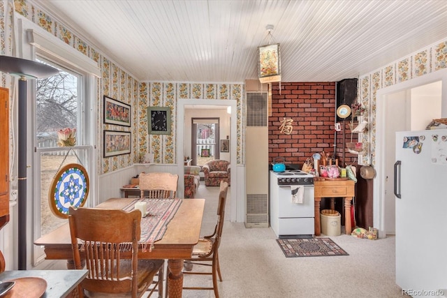 dining room featuring light colored carpet