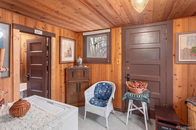 bedroom featuring wood ceiling, carpet flooring, and wooden walls