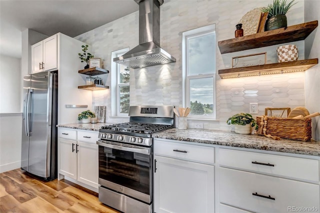 265 Upper Glenway, Palmer Lake, CO 80133 - kitchen featuring open shelves, stainless steel appliances, wall chimney exhaust hood, light wood-style flooring, and white cabinets