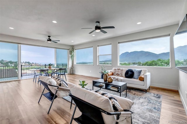 265 Upper Glenway, Palmer Lake, CO 80133 - living room with a ceiling fan, light wood-style floors, and recessed lighting