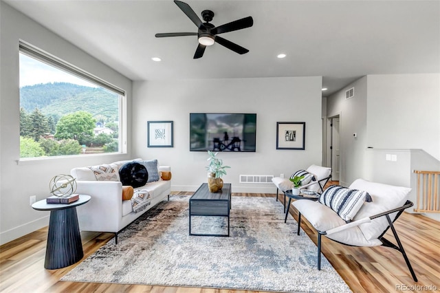 265 Upper Glenway, Palmer Lake, CO 80133 - living area with wood finished floors, ceiling fan, and recessed lighting