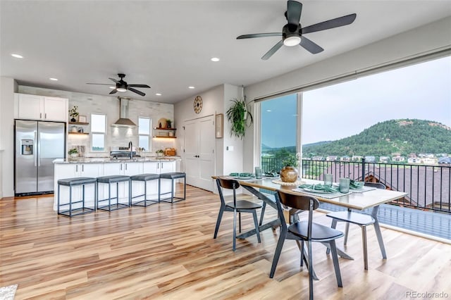 265 Upper Glenway, Palmer Lake, CO 80133 - dining room with ceiling fan, light wood-style flooring, plenty of natural light, and recessed lighting
