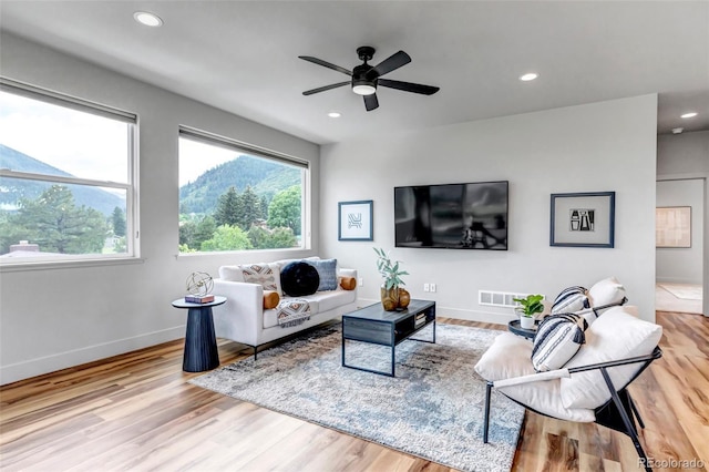 265 Upper Glenway, Palmer Lake, CO 80133 - living room with healthy amount of natural light, a ceiling fan, wood finished floors, and recessed lighting