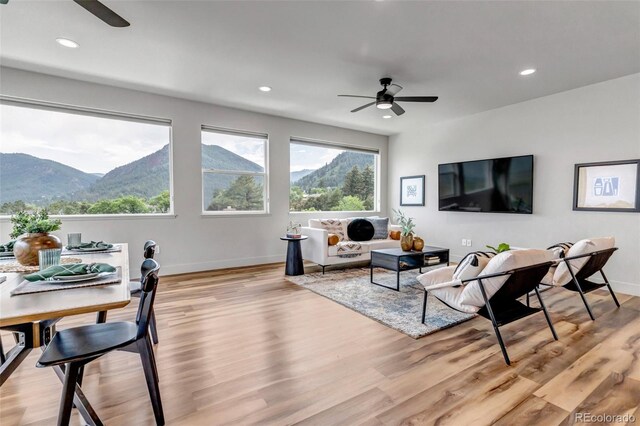 265 Upper Glenway, Palmer Lake, CO 80133 - living area with ceiling fan, light wood-style flooring, recessed lighting, and a mountain view