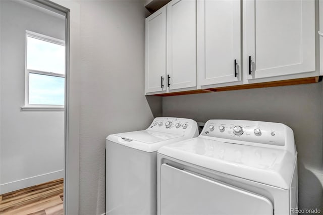 265 Upper Glenway, Palmer Lake, CO 80133 - laundry area with separate washer and dryer, cabinet space, and wood finished floors