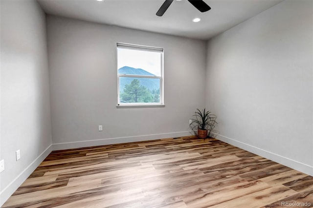 265 Upper Glenway, Palmer Lake, CO 80133 - unfurnished room featuring a ceiling fan, wood finished floors, and recessed lighting
