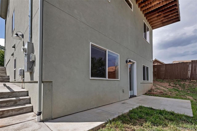 265 Upper Glenway, Palmer Lake, CO 80133 - view of side of home featuring a patio and stucco siding