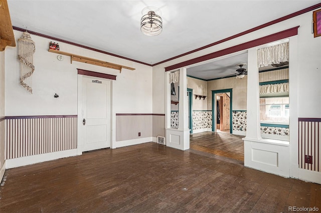 spare room featuring ceiling fan, crown molding, and dark hardwood / wood-style floors