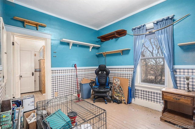 interior space with wood-type flooring and crown molding