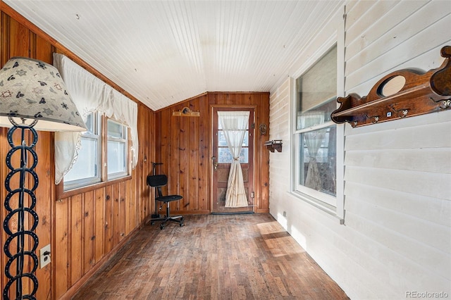 unfurnished sunroom featuring plenty of natural light and lofted ceiling