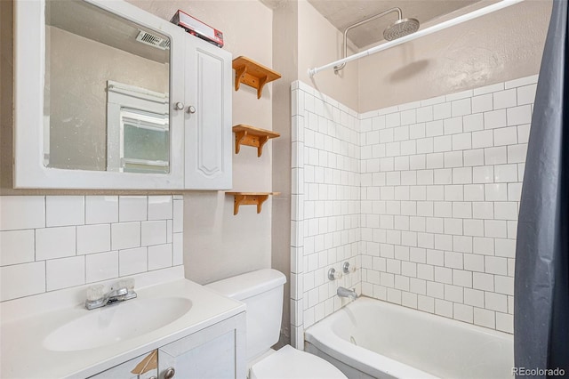 full bathroom with vanity, toilet, and shower / bath combo with shower curtain