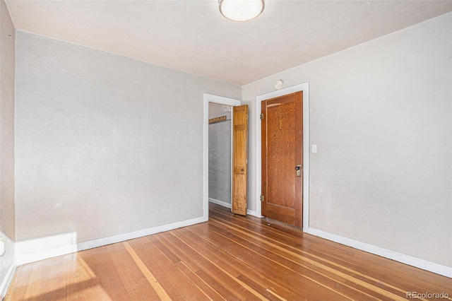 spare room featuring hardwood / wood-style floors