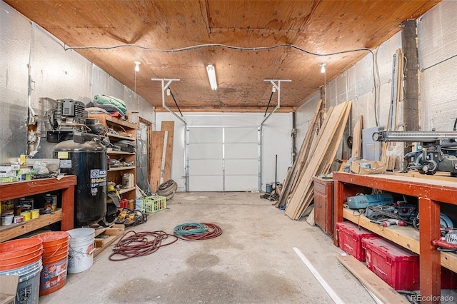 garage with a workshop area