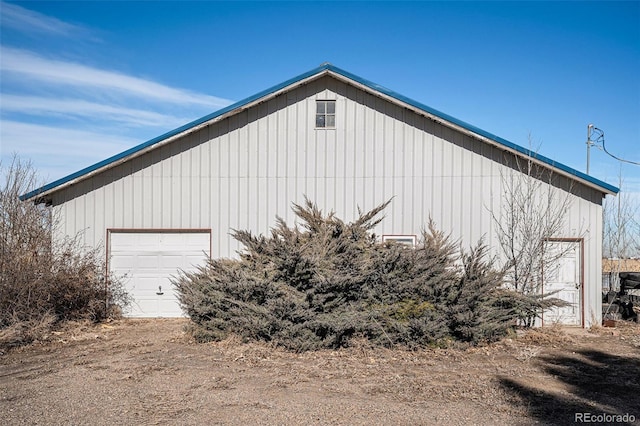 view of side of home with an outbuilding