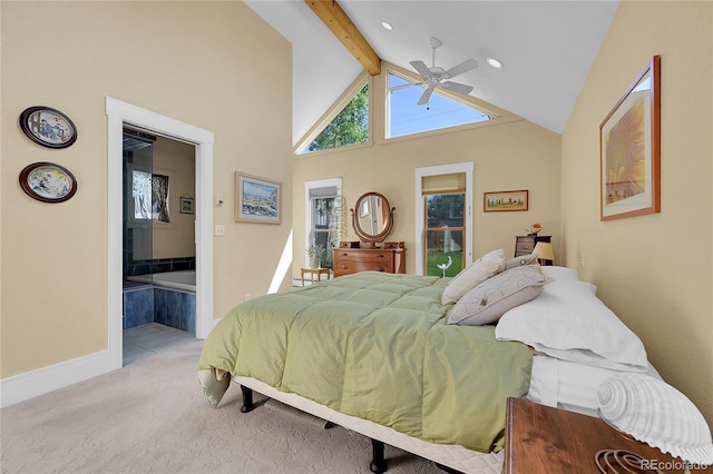 bedroom with beam ceiling, high vaulted ceiling, ensuite bath, baseboards, and light colored carpet