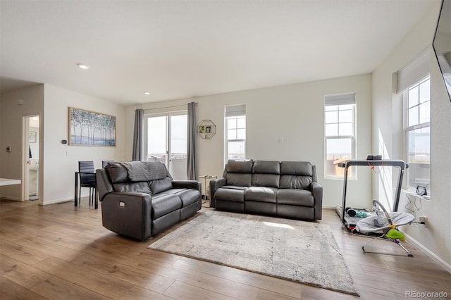 608 N Bersshine Ct, Aurora, CO 80137 - living room featuring hardwood / wood-style flooring, plenty of natural light, and recessed lighting