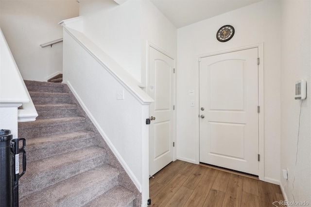 608 N Bersshine Ct, Aurora, CO 80137 - entrance foyer with light wood-type flooring and stairs