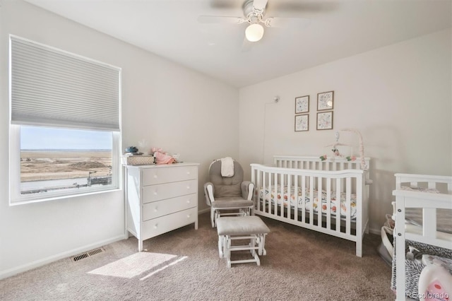 608 N Bersshine Ct, Aurora, CO 80137 - bedroom featuring carpet, a nursery area, and ceiling fan