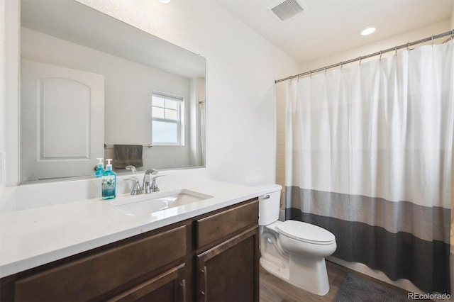 608 N Bersshine Ct, Aurora, CO 80137 - bathroom with vanity, wood finished floors, and recessed lighting