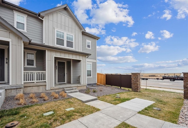 608 N Bersshine Ct, Aurora, CO 80137 - view of front of property featuring board and batten siding and a porch