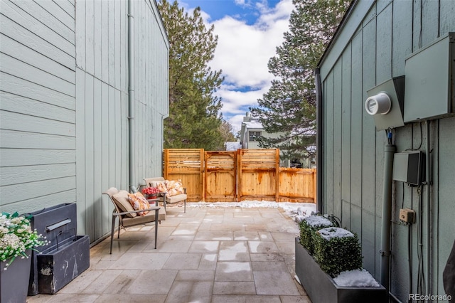 view of patio / terrace featuring fence