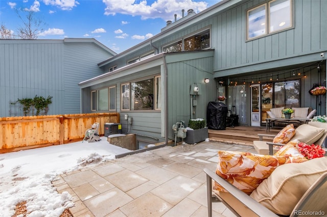 back of house featuring a patio area, fence, an outdoor living space, and central air condition unit