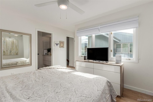 bedroom with ceiling fan, light wood-type flooring, and baseboards