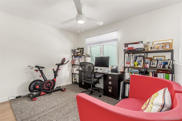 office space featuring wood finished floors, a ceiling fan, and baseboards