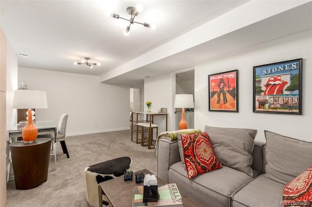 living area featuring light carpet and baseboards