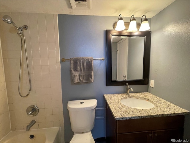 bathroom featuring toilet, shower / bathtub combination, visible vents, and vanity