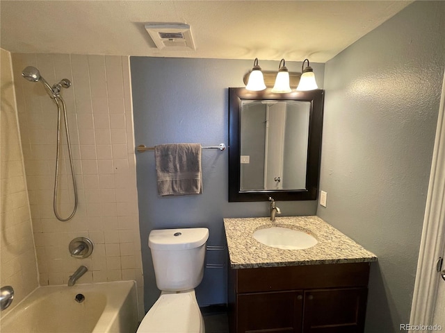 bathroom with toilet, shower / tub combination, visible vents, and vanity