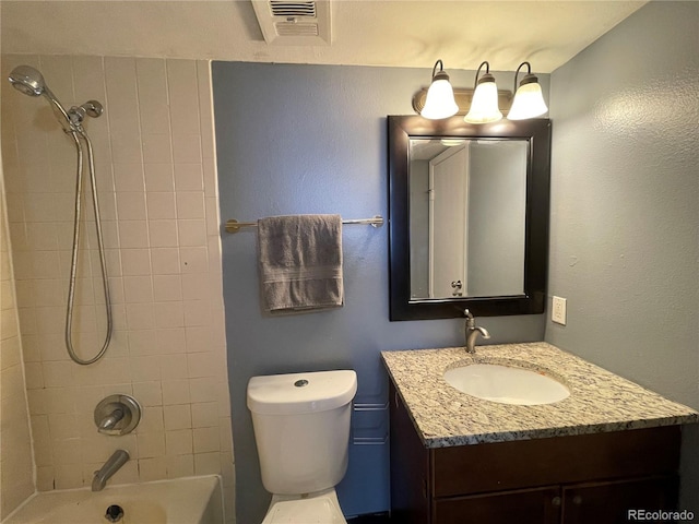 bathroom featuring shower / washtub combination, visible vents, vanity, and toilet