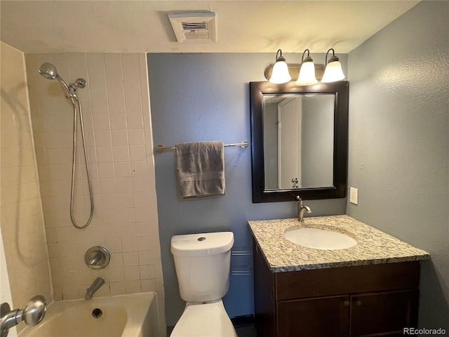 bathroom with toilet, shower / tub combination, visible vents, and vanity