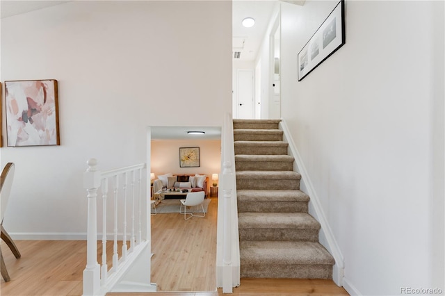 4249 S Biscay Cir, Aurora, CO 80013 - stairway featuring wood finished floors and baseboards