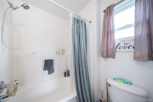 bathroom with toilet and shower / tub combo