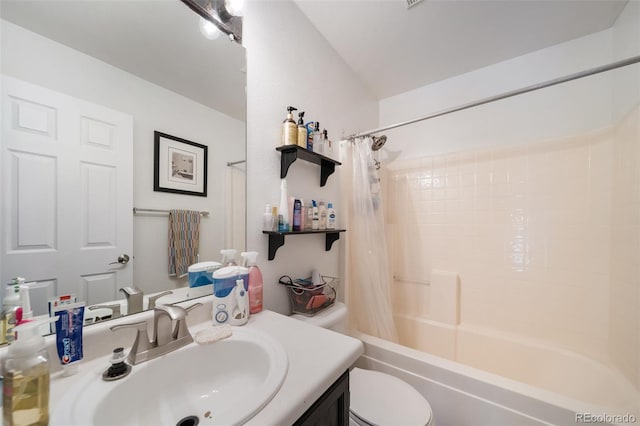 full bathroom featuring shower / bath combo, toilet, and vanity