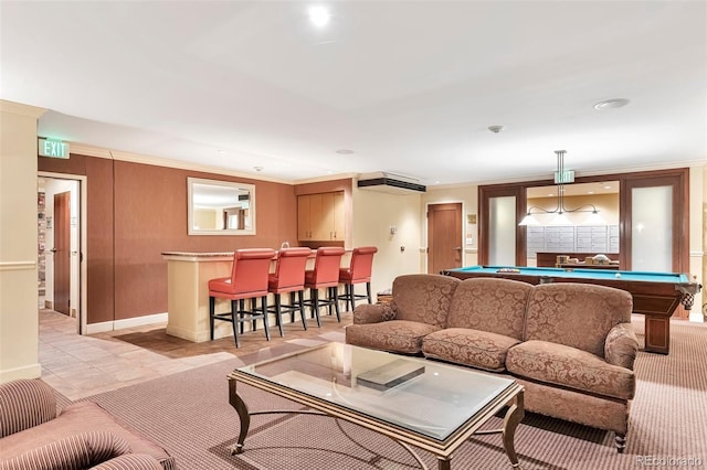 living room featuring pool table, a community bar, ornamental molding, and baseboards